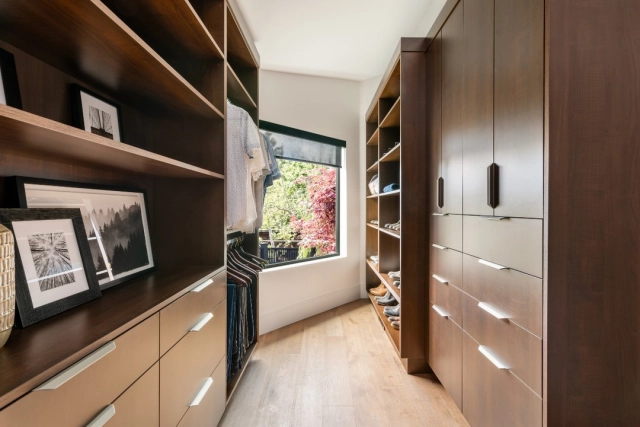 Featuring rich wood tones, this walk-in closet